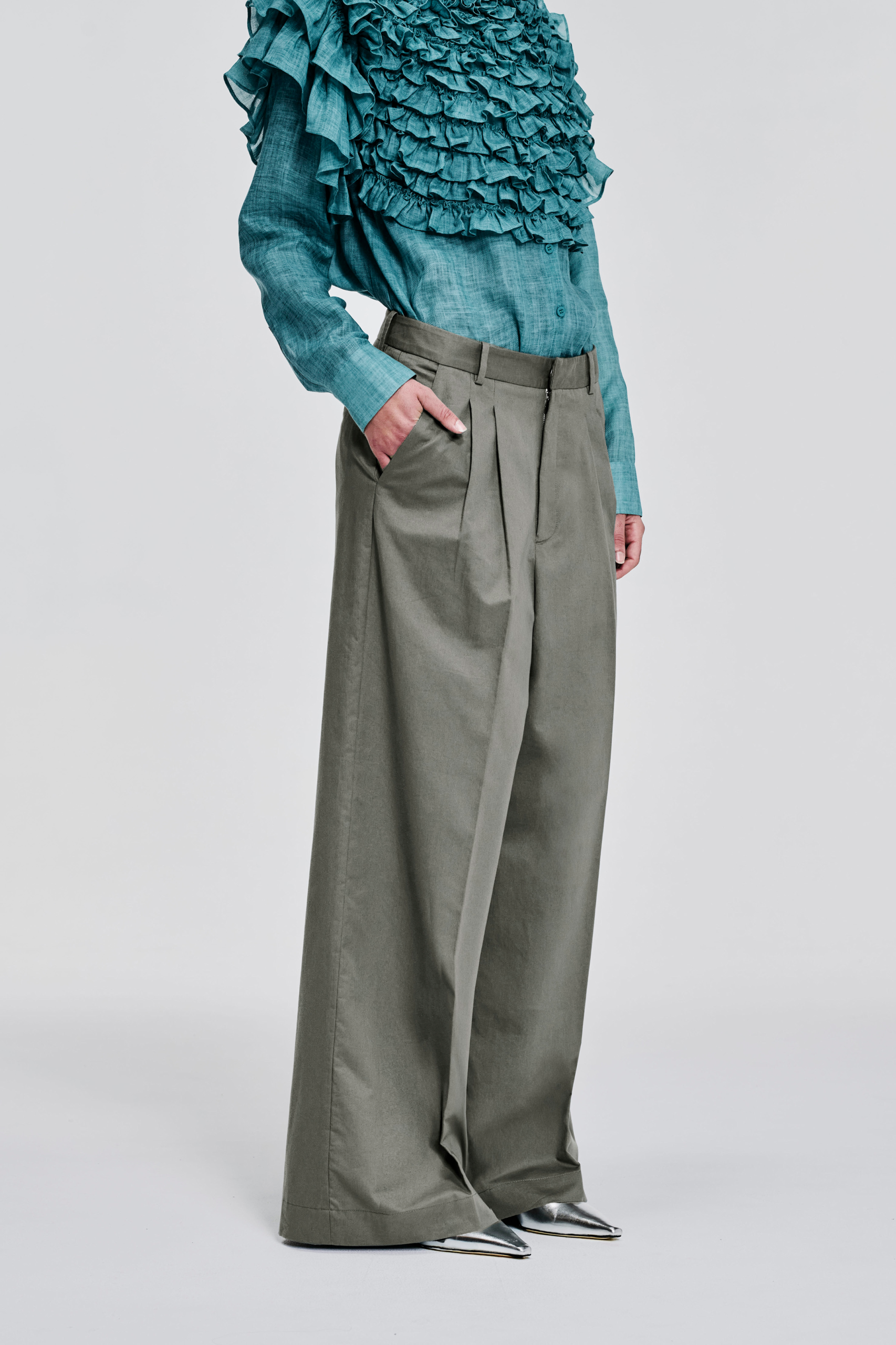 Detail view of KIM C STUDIO sage khaki cotton wide-leg trousers