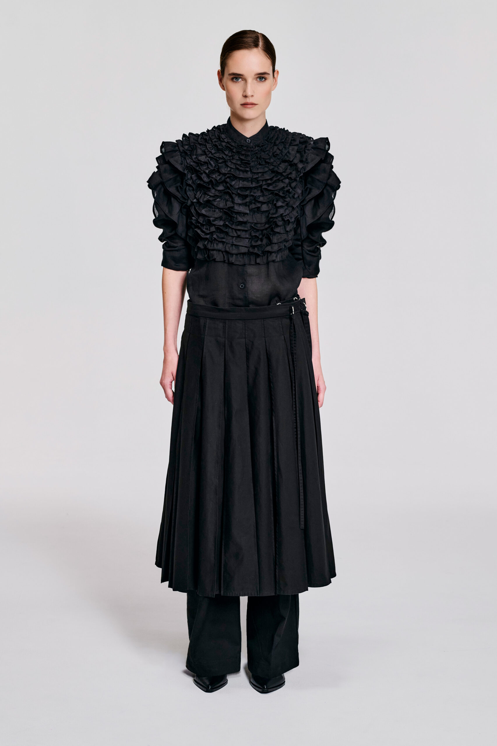Black Cotton Wrap Skirt with sewn pleat detailing and an adjustable D-ring waist by KimC Studio.