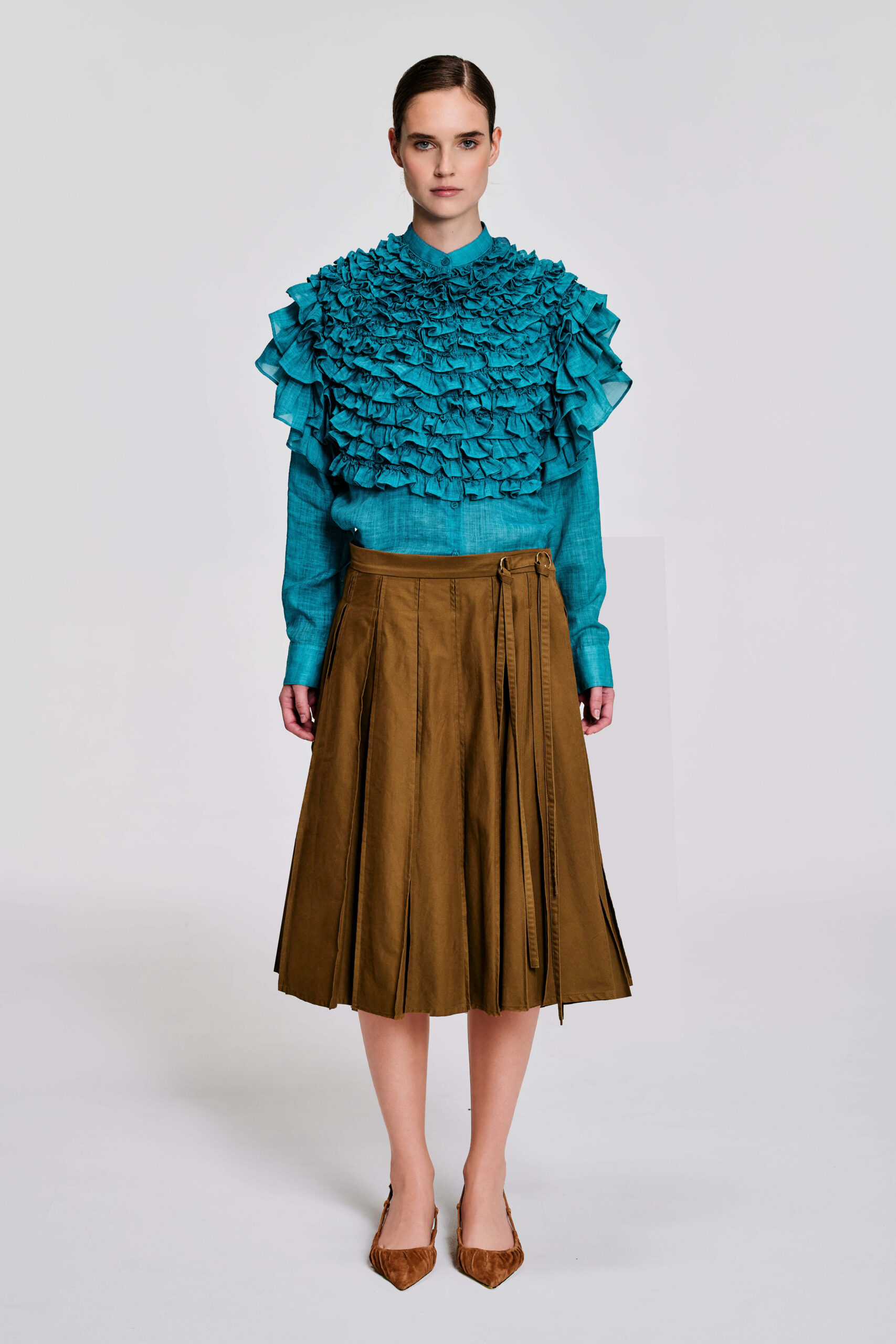 Model wearing a camel khaki cotton wrap skirt with adjustable waist rings and long string ties by KimC Studio.