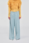 Front view model wearing pale blue wide-leg linen pants by KimC Studio.