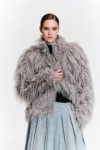 Front view of model wearing grey faux fur jacket with zip, drawstring hem by KimC Studio.