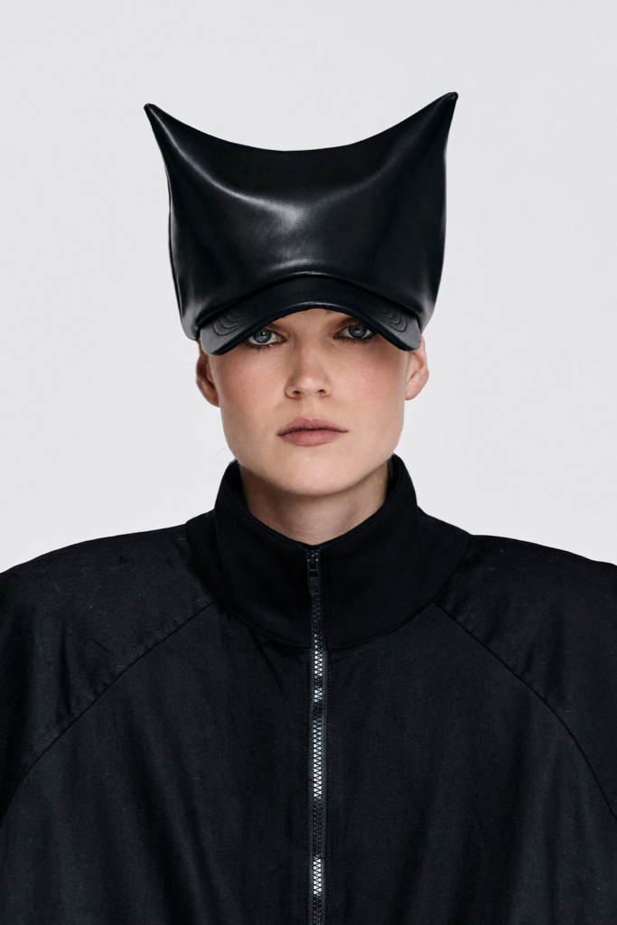 Front view of Black Sculptural Faux Leather Cap