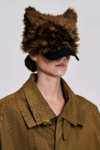 Model wearing the KIMC Studio Brown Sculptural Faux Fur Cap