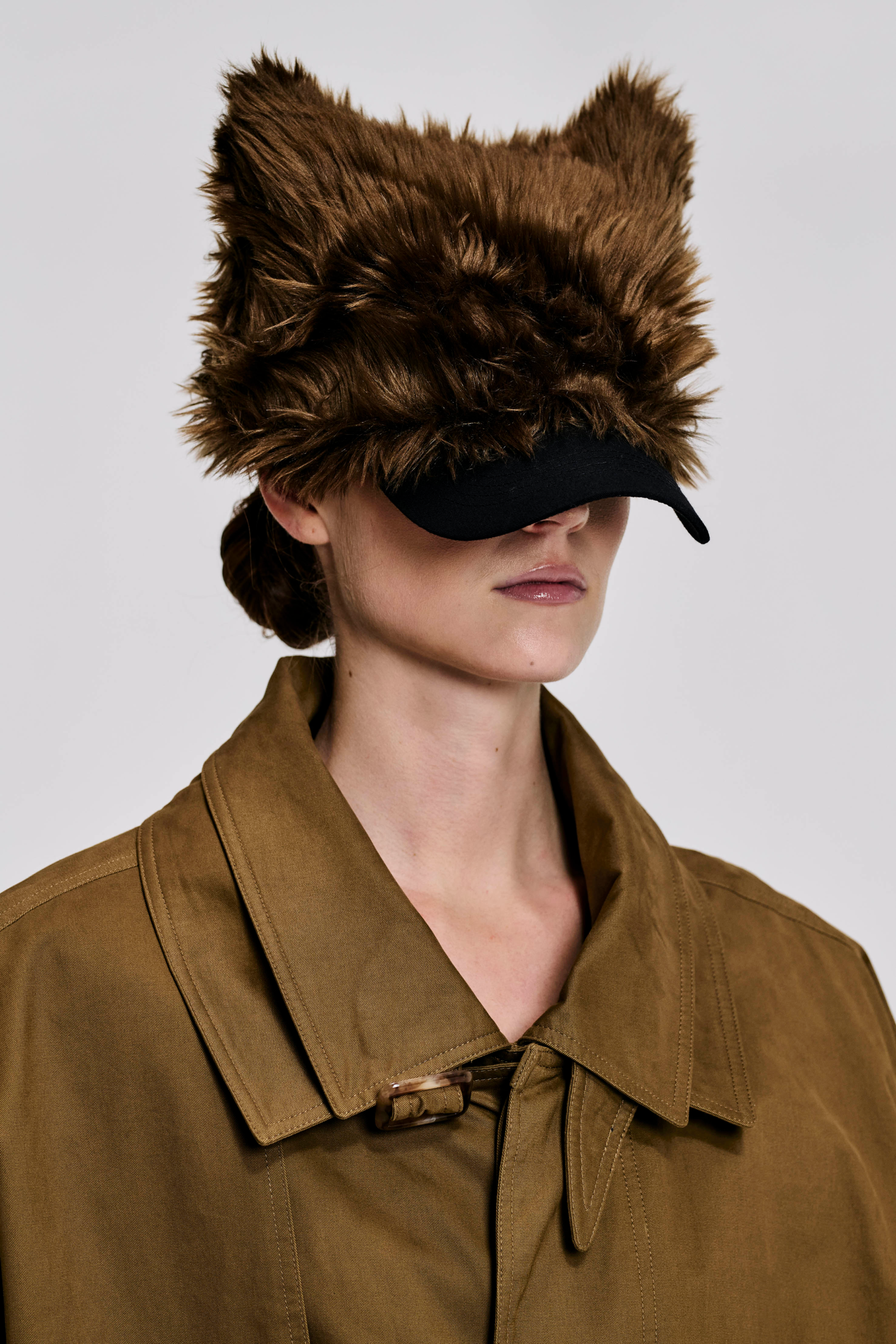 Model wearing the KIMC Studio Brown Sculptural Faux Fur Cap