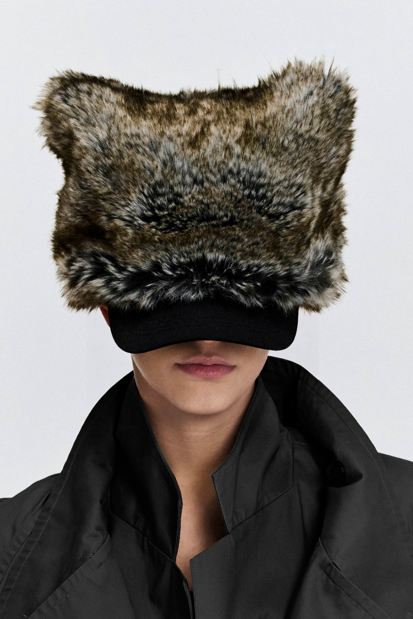 Model wearing the KIMC Studio Grey Sculptural Faux Fur Cap