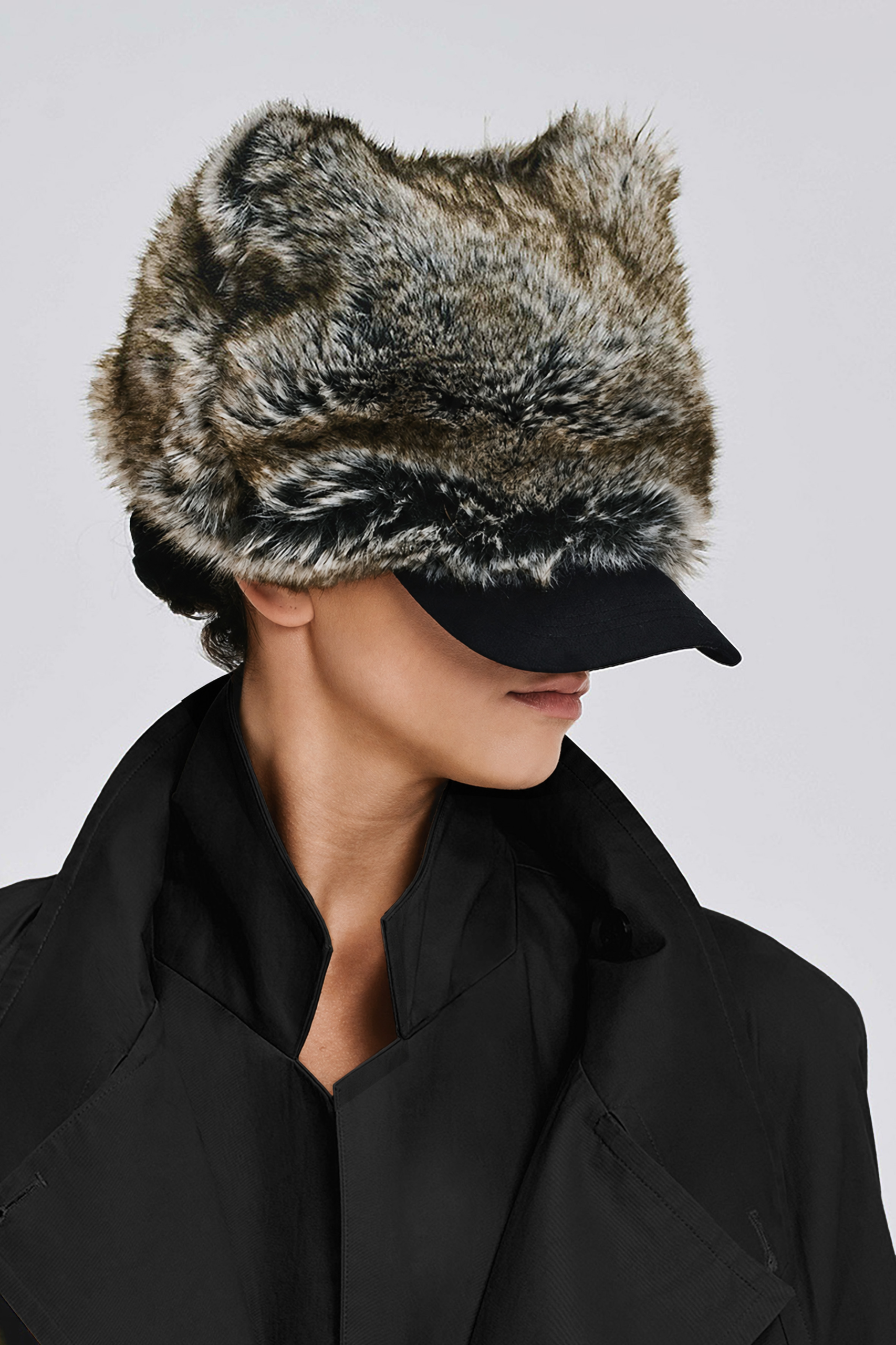 Model wearing the KIMC Studio Grey Sculptural Faux Fur Cap