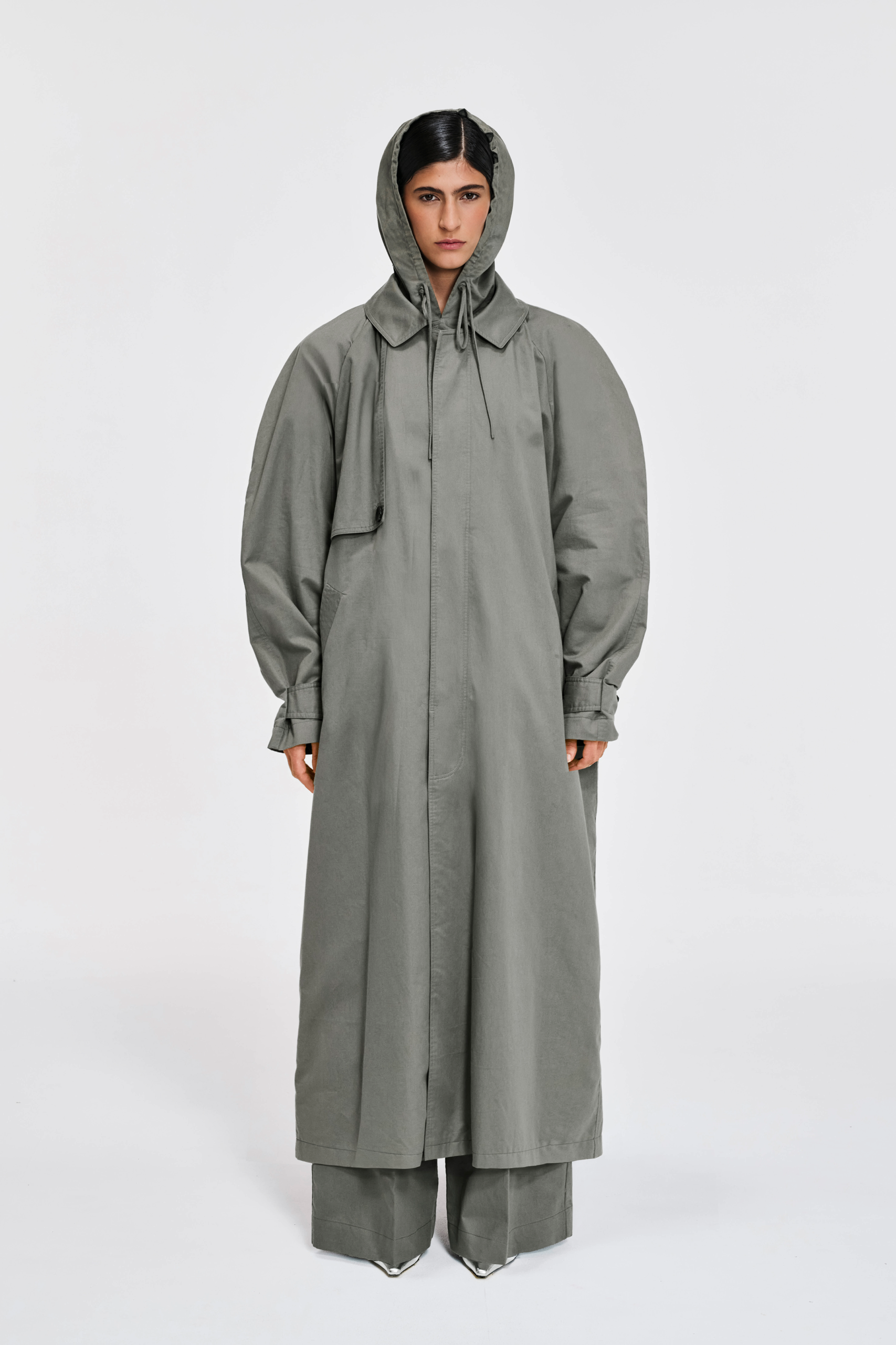 Front view of full-length sage hooded cotton trench coat