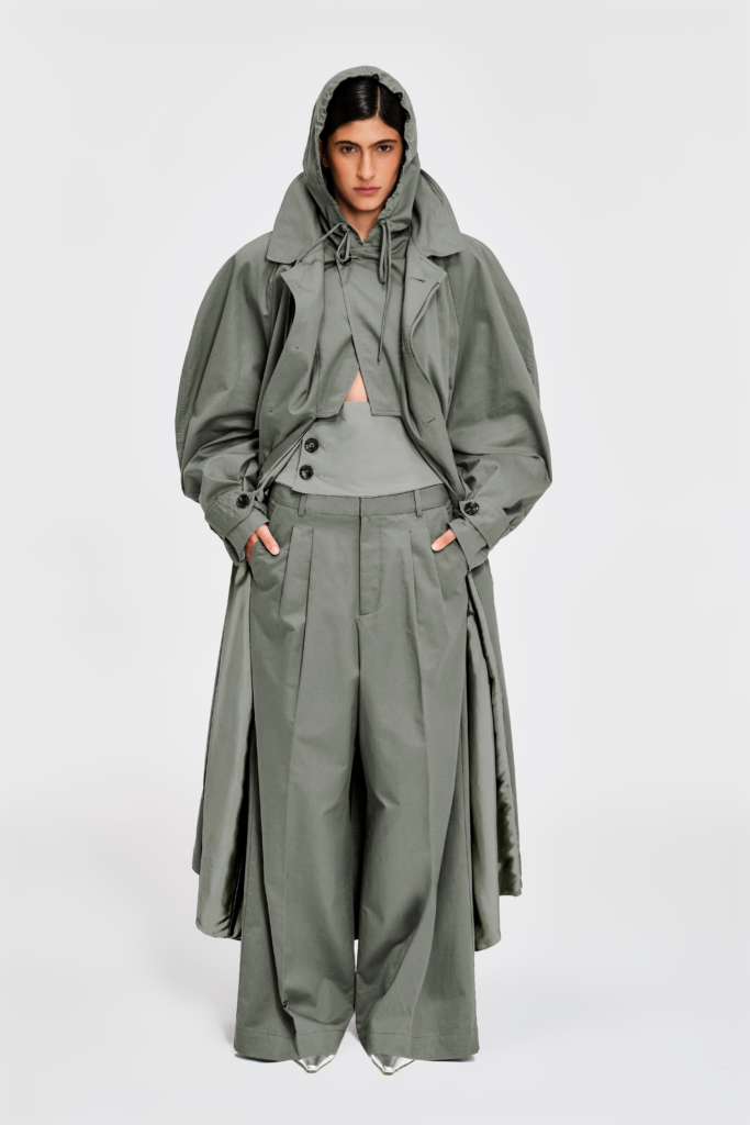 Detail view of full-length sage hooded cotton trench coat