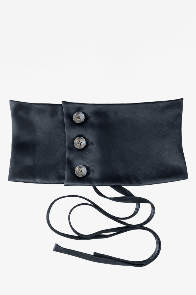 Front view of KIM C STUDIO sage satin corset belt with three buttons